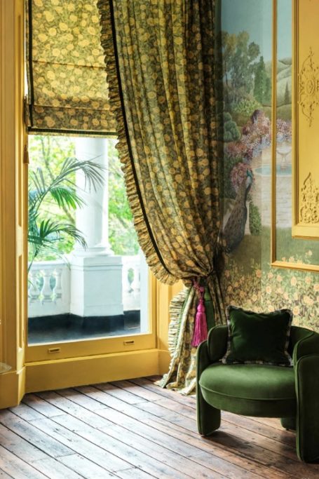 Green anf yellow sitting room with wooden floors | British textile designers