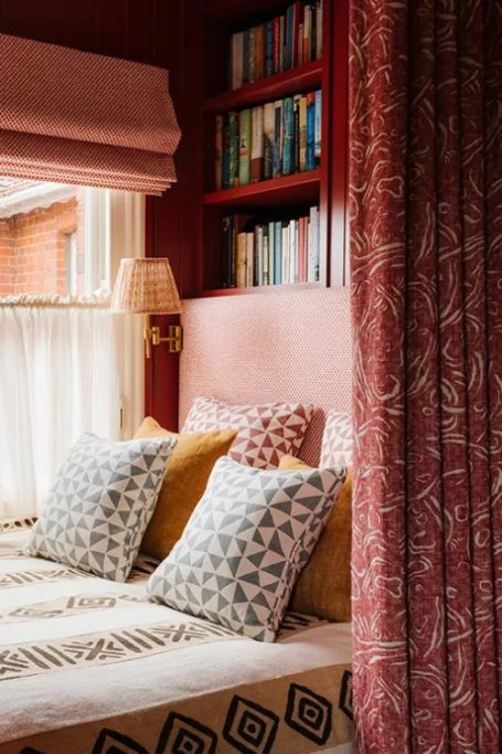 Red bedroom with canopy | British textile designers
