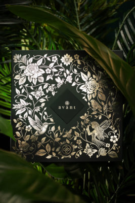Metallic box surrounded by leaves