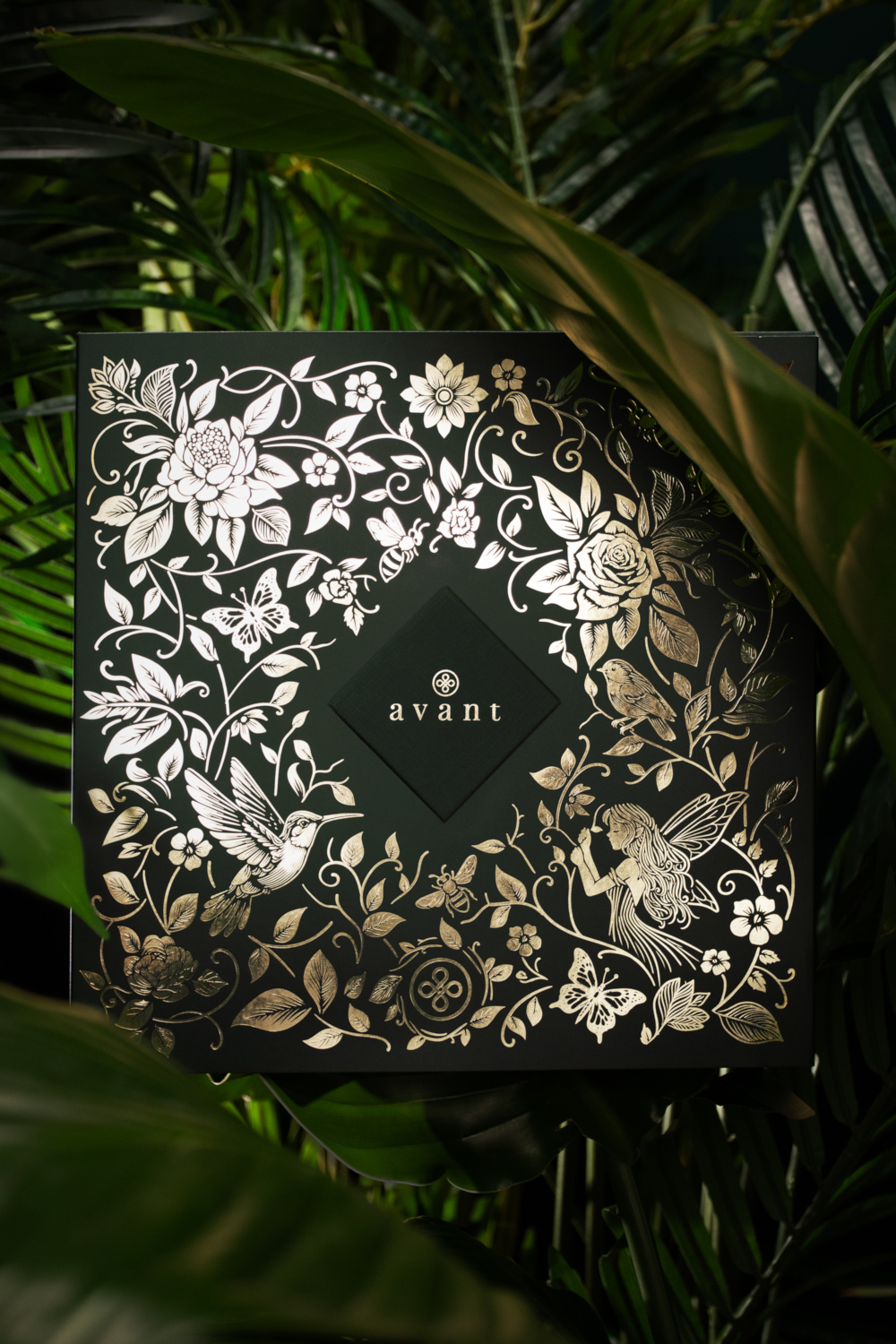 Metallic box surrounded by leaves