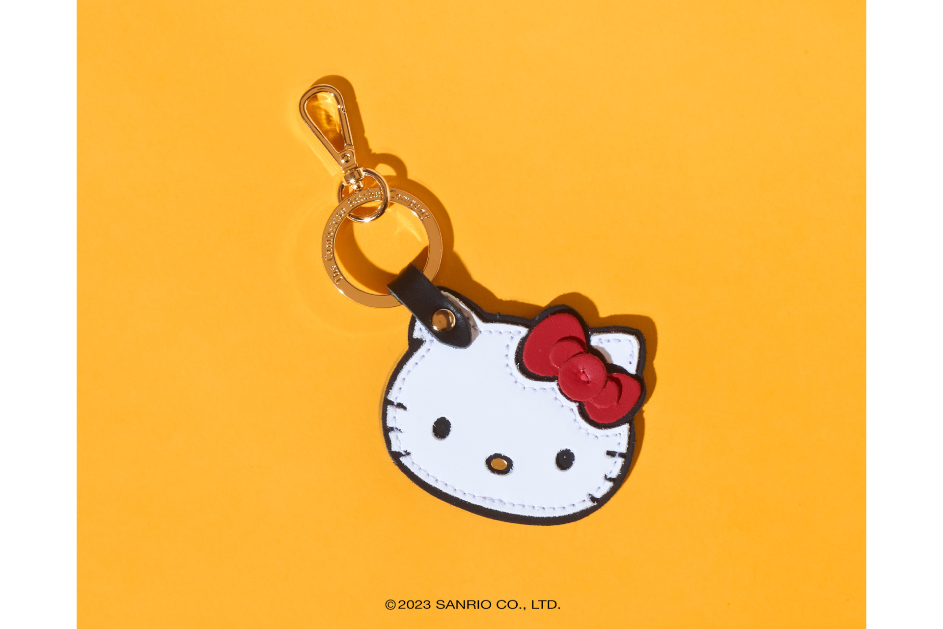 Hello Kitty keyring on yellow background