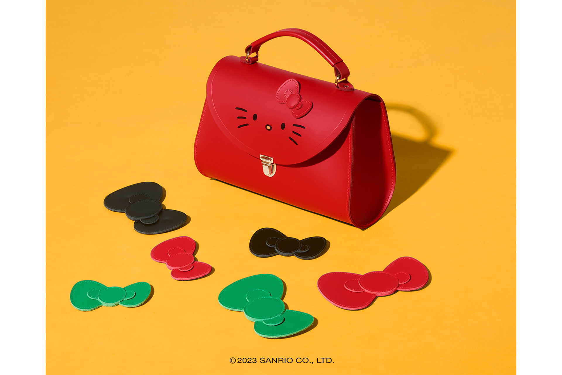 Red bag surrounded by multi-coloured bows