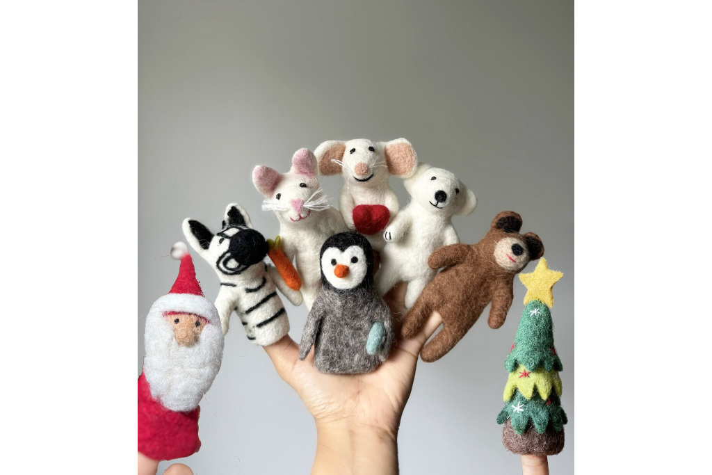 Hand holding finger puppets