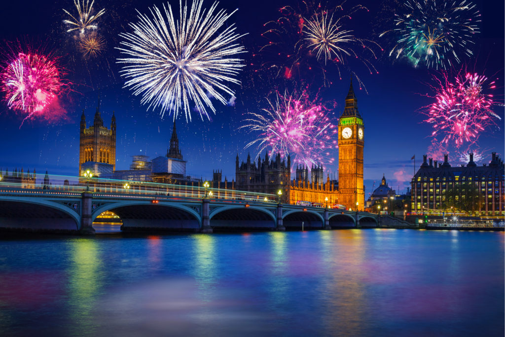 New years fireworks display over the Big Ben and Westminster Bridge in London, UK