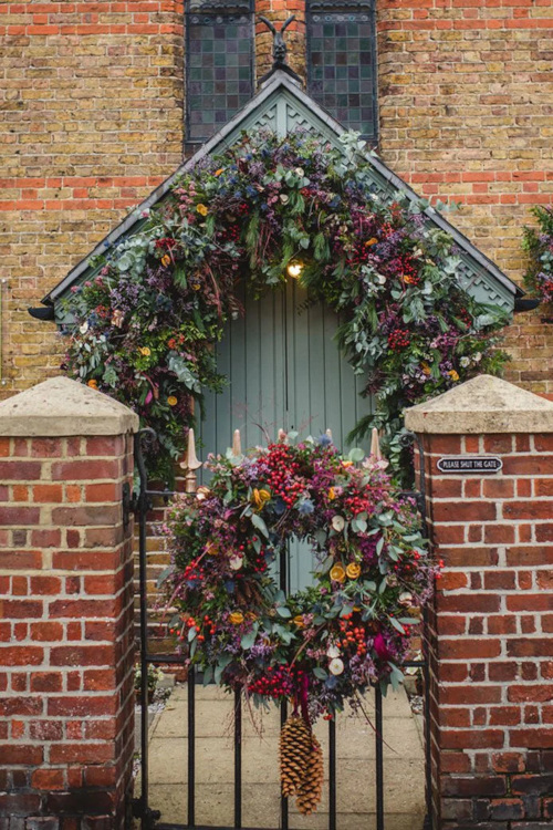 Gate and front door with garlands