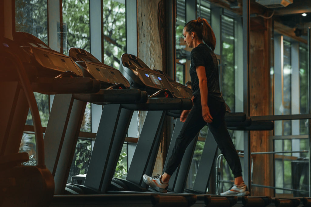 Woman walking on treadmill - 12-3-30 workout
