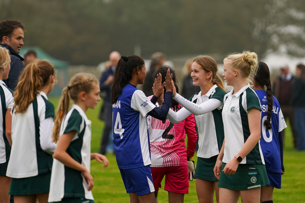 Children from the OSCAR Foundation and Beaudesert Park School playing football together