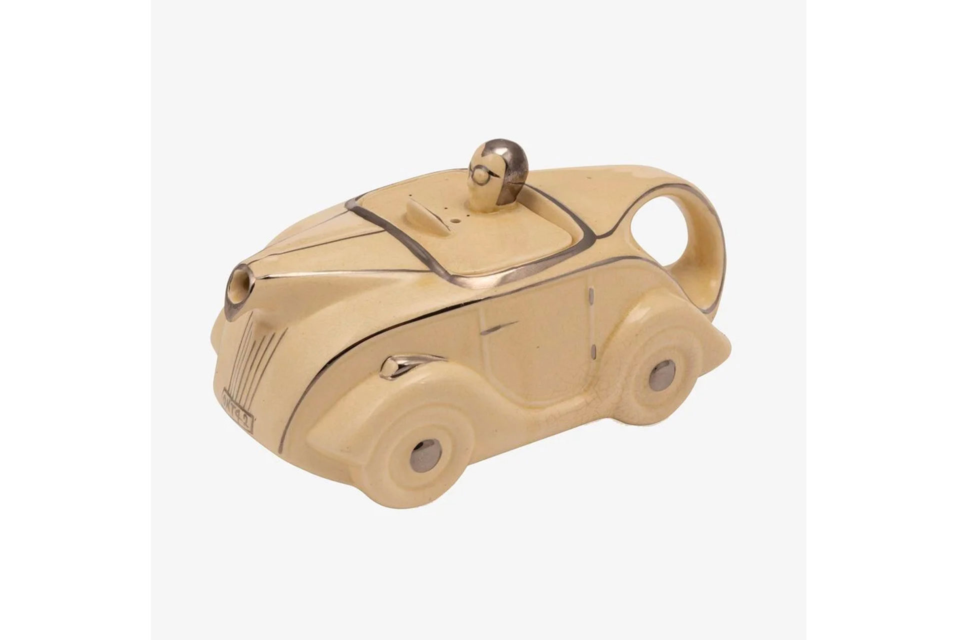 Old Cinema antique teapot, shaped like racing car