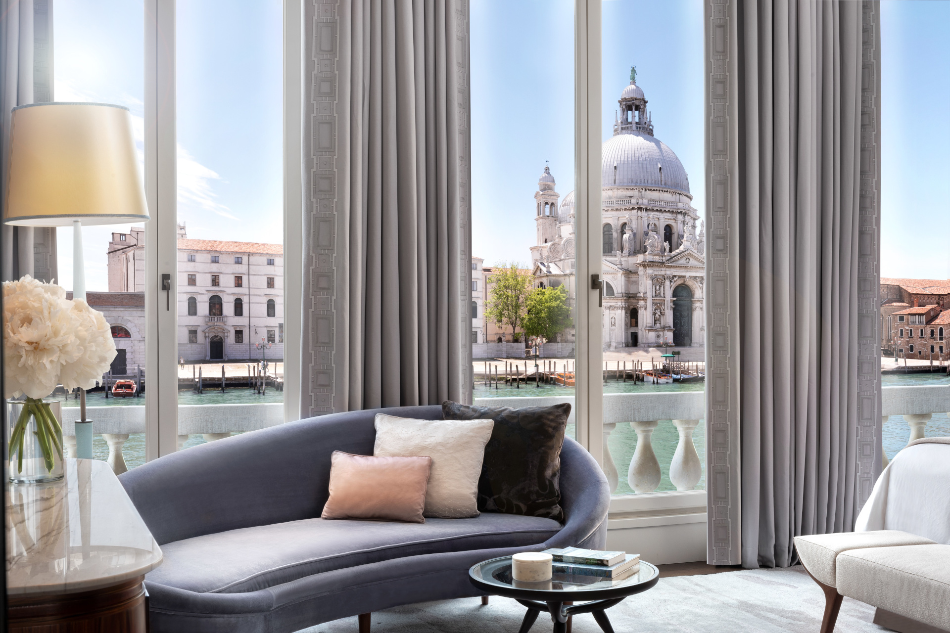 Elegant sitting room with windows overlooking Venetian canal