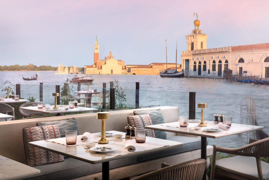 Tables overlooking Venetian canal