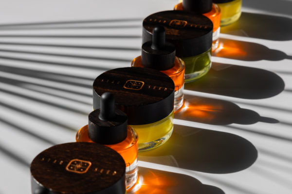 Line of skincare creams and serums with dark shadows