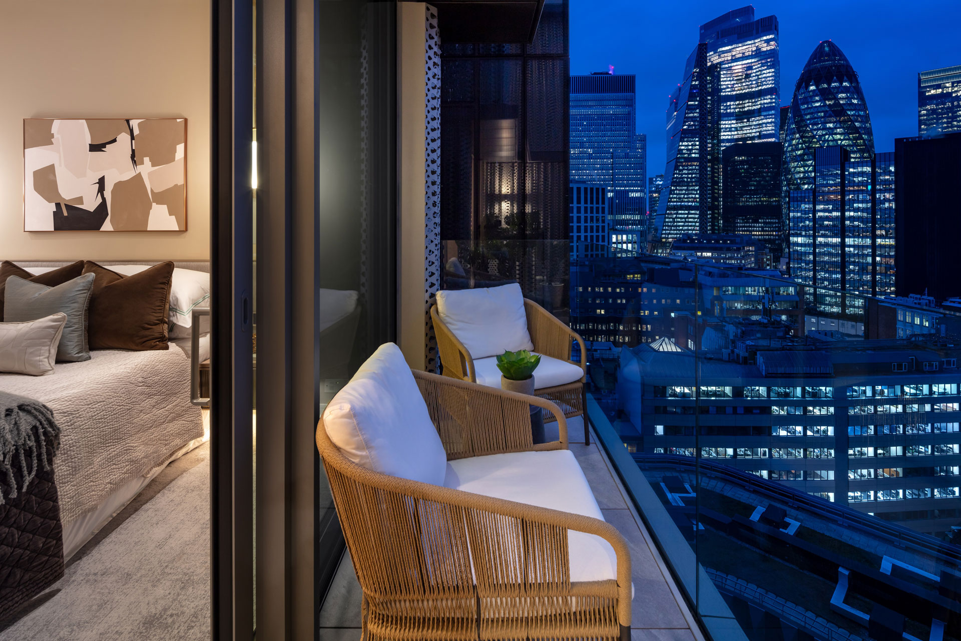 Penthouse bedroom with balcony overlooking The Gherkin.
