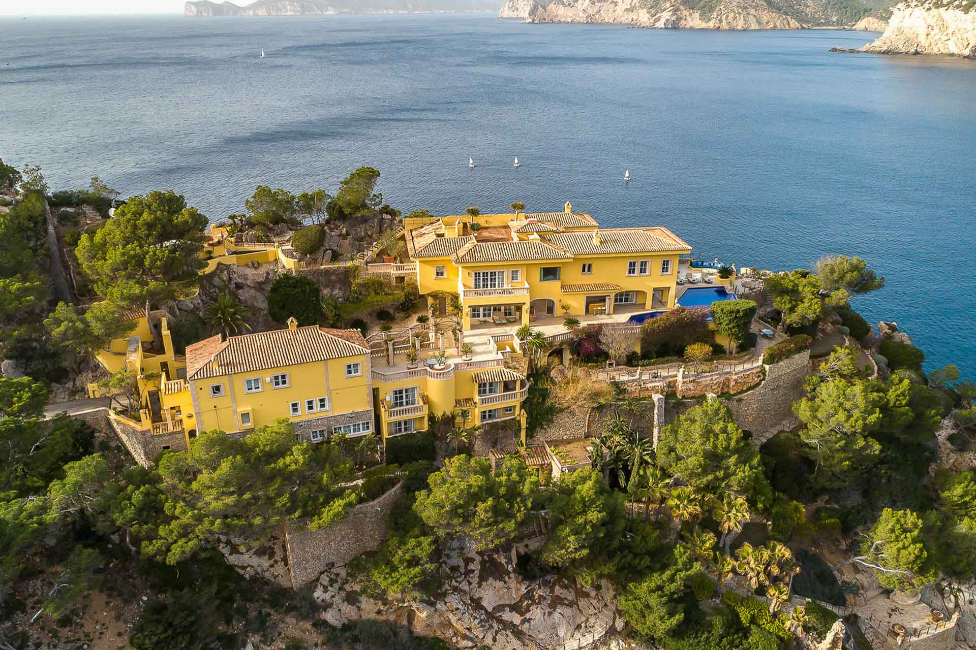 Birdseye view of yellow Mallorcan villa