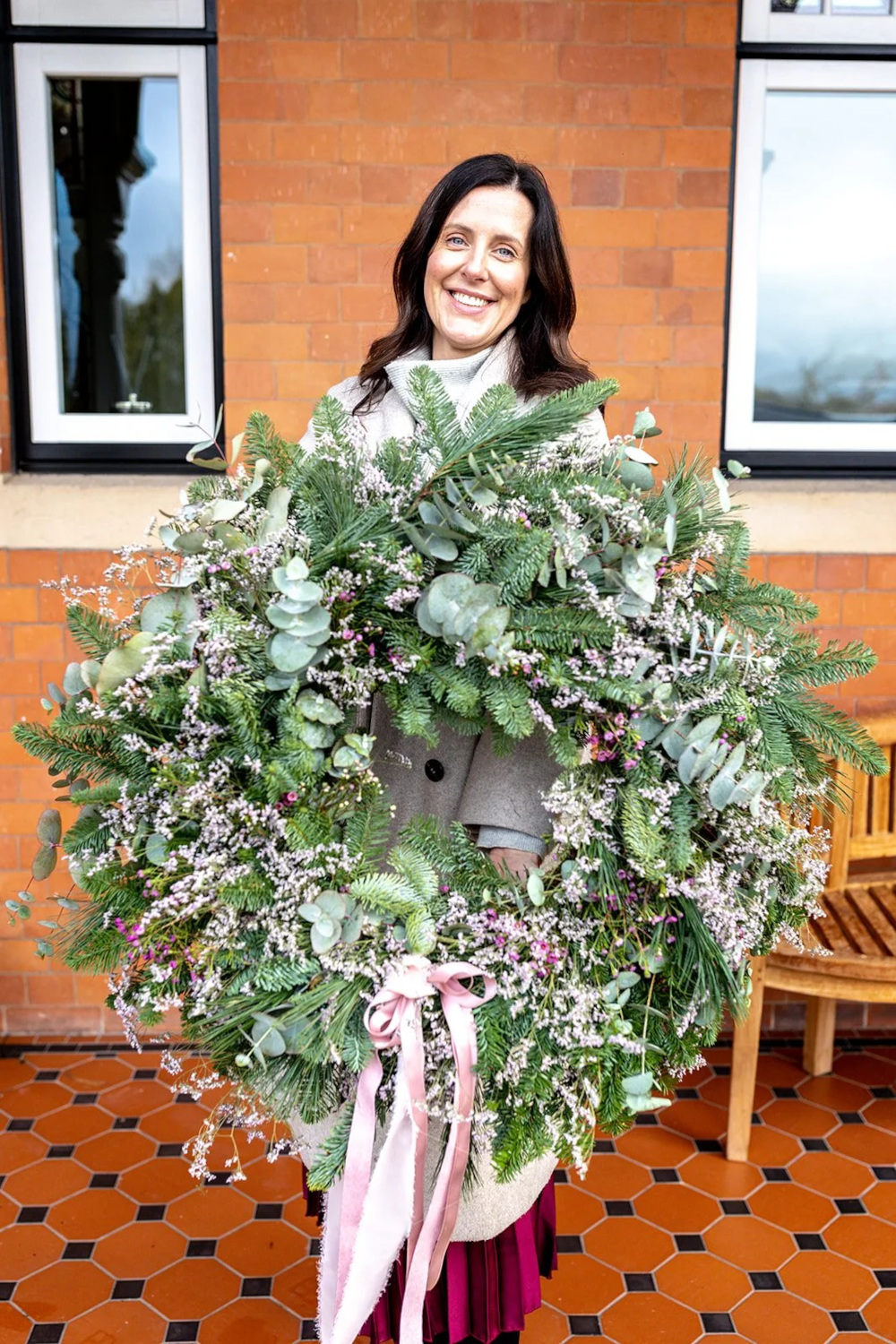 Woman holding floral arrangement