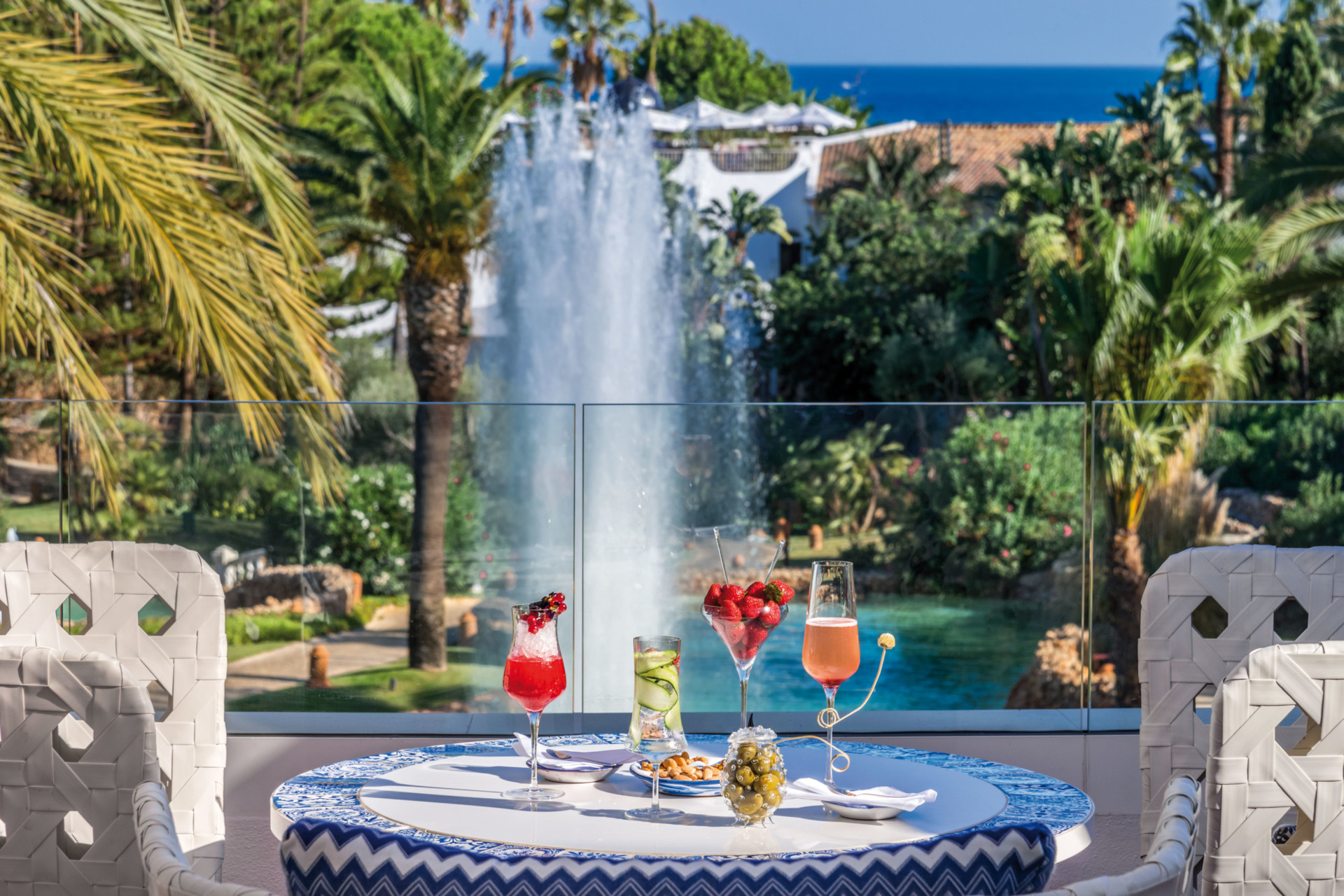 Table set with cocktails by water feature