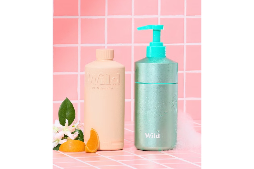 Pink and blue bottle on pink tile background