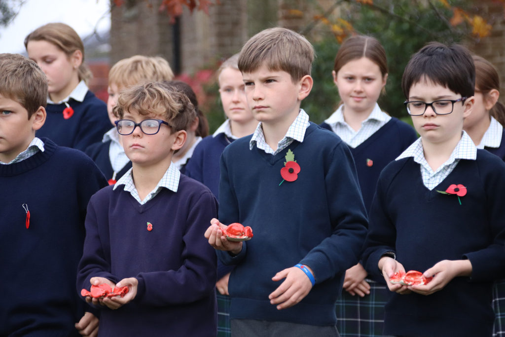 Highfield & Brookham pupils holding their ceramic Poppies