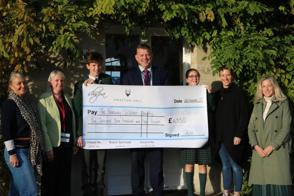 Spratton Hall presenting the cheque to Jane Deamer from The Faraway Children's Charity