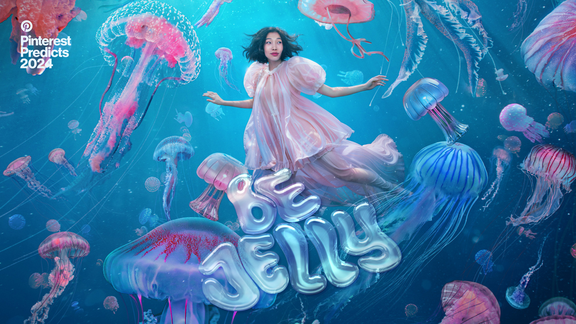 Woman underwater with jellyfish