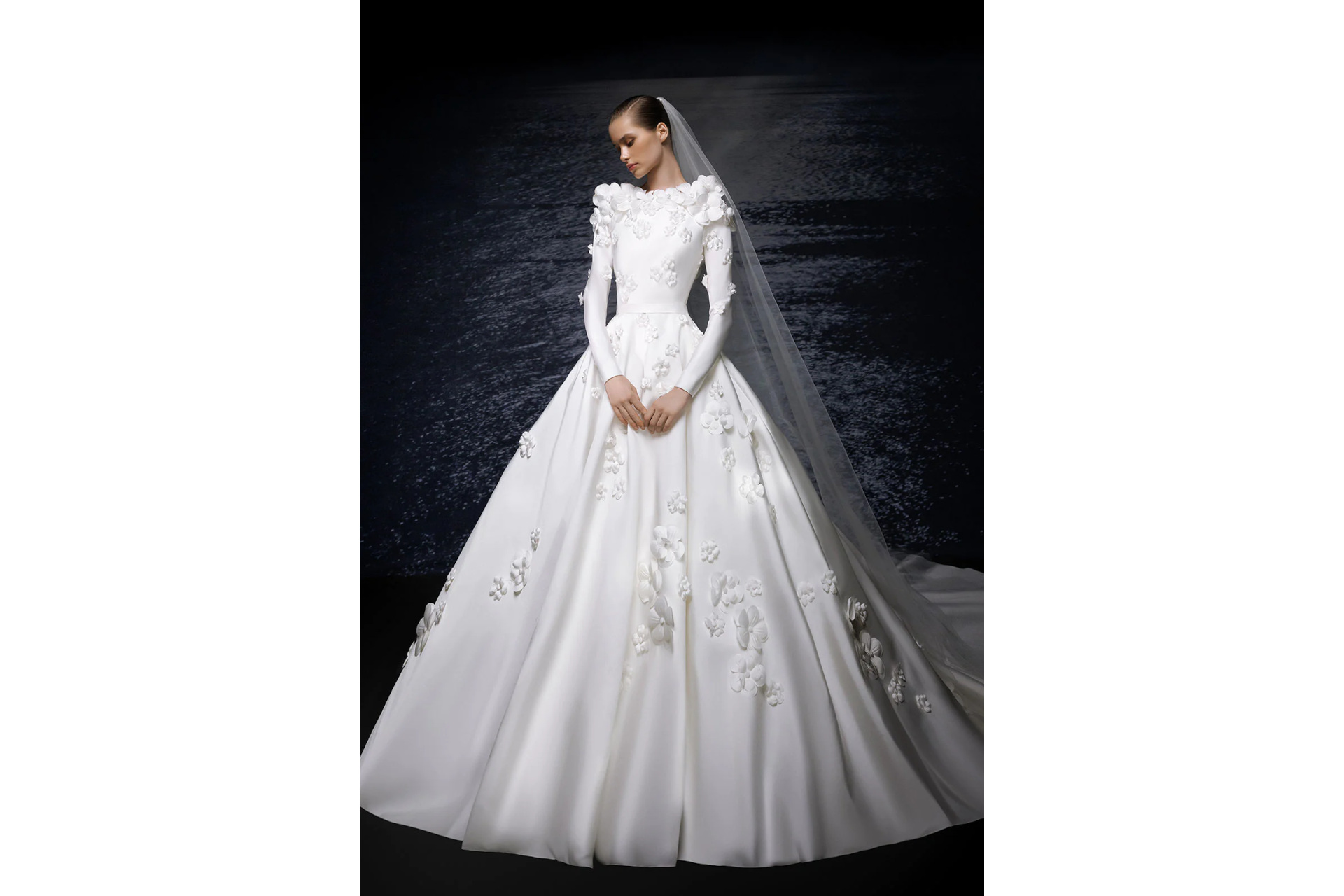 Woman in white long sleeve wedding dress