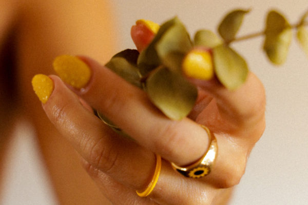 Close up of hand with yellow nails | Nail Trends 2024