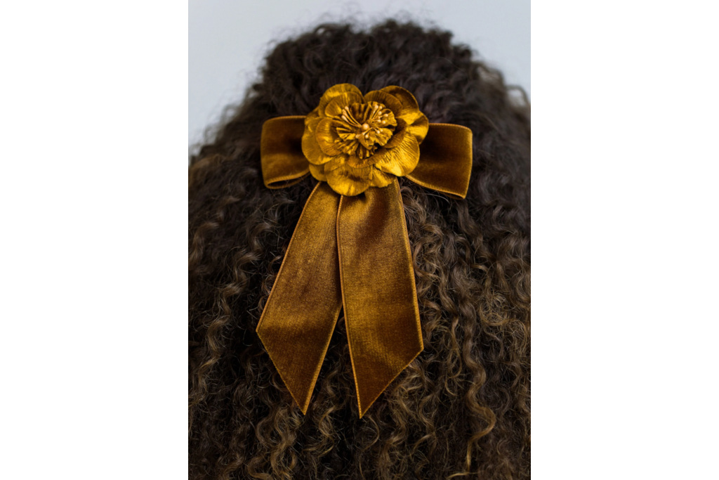 Close up of hair with floral bow