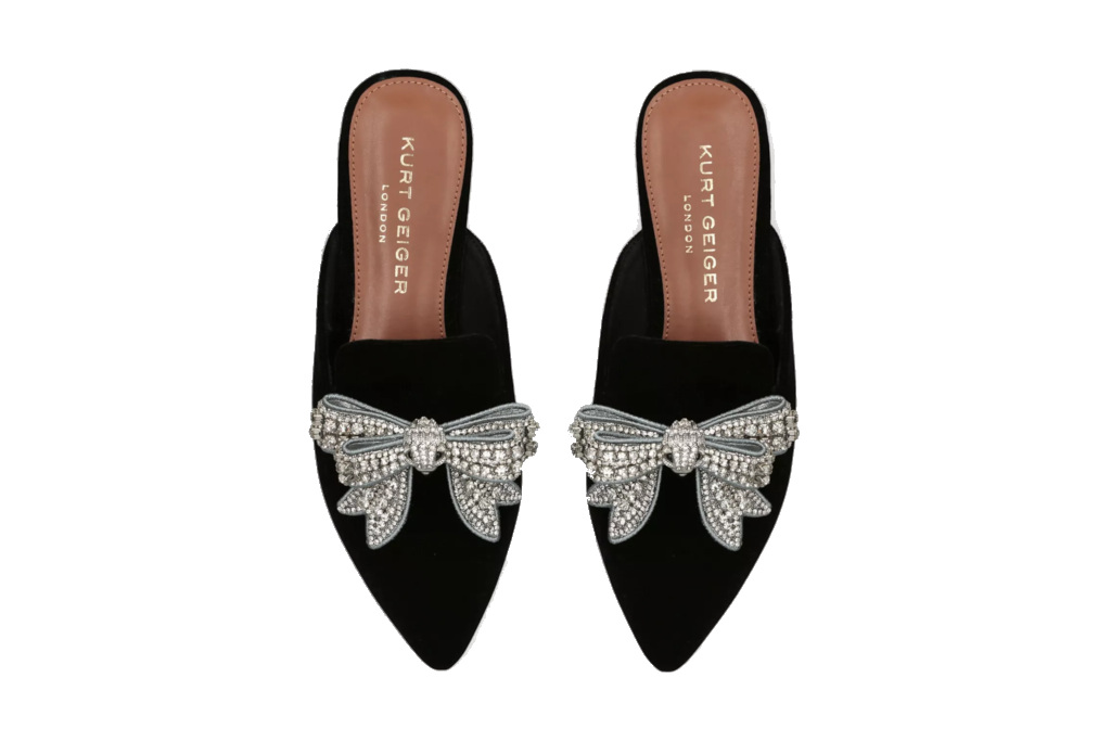 Black slippers with silver bows