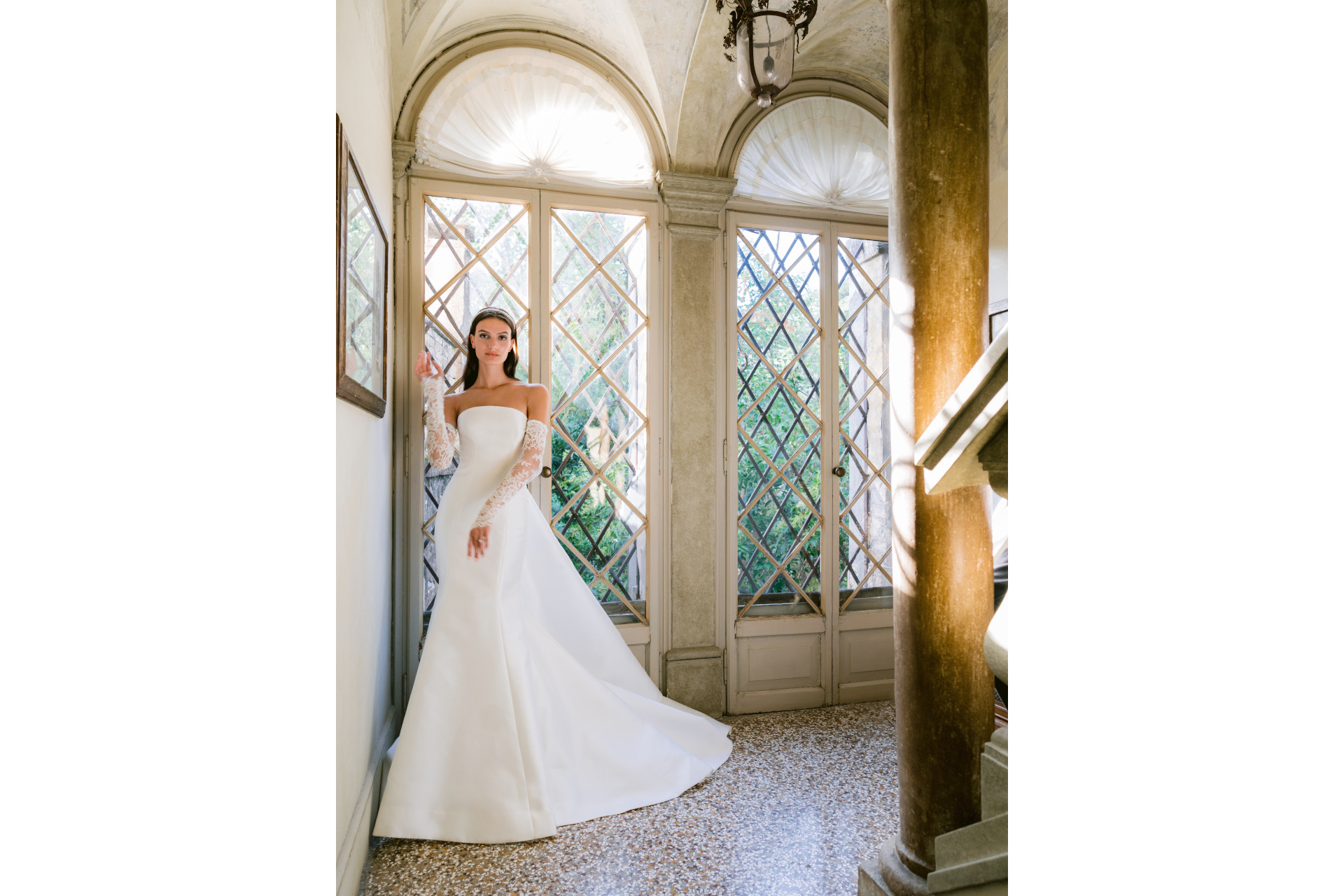 Woman in white dress with sheer sleeves