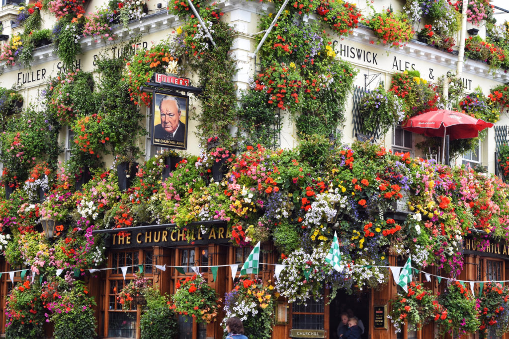 The Churchill Arms pub facade decorated in flowers
