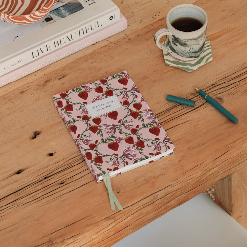 Pink notebook on desk