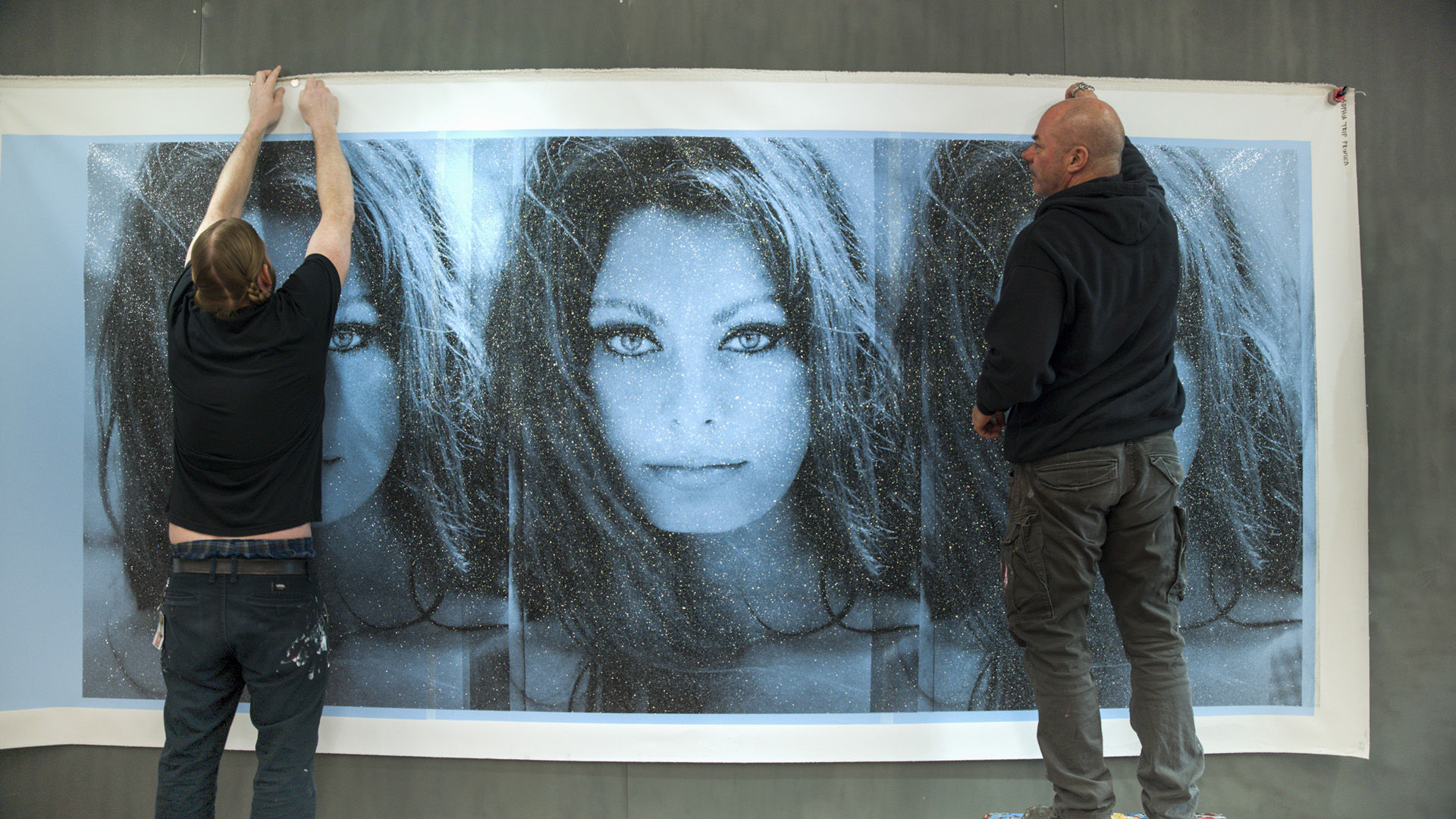 Pinning up Russell's artwork