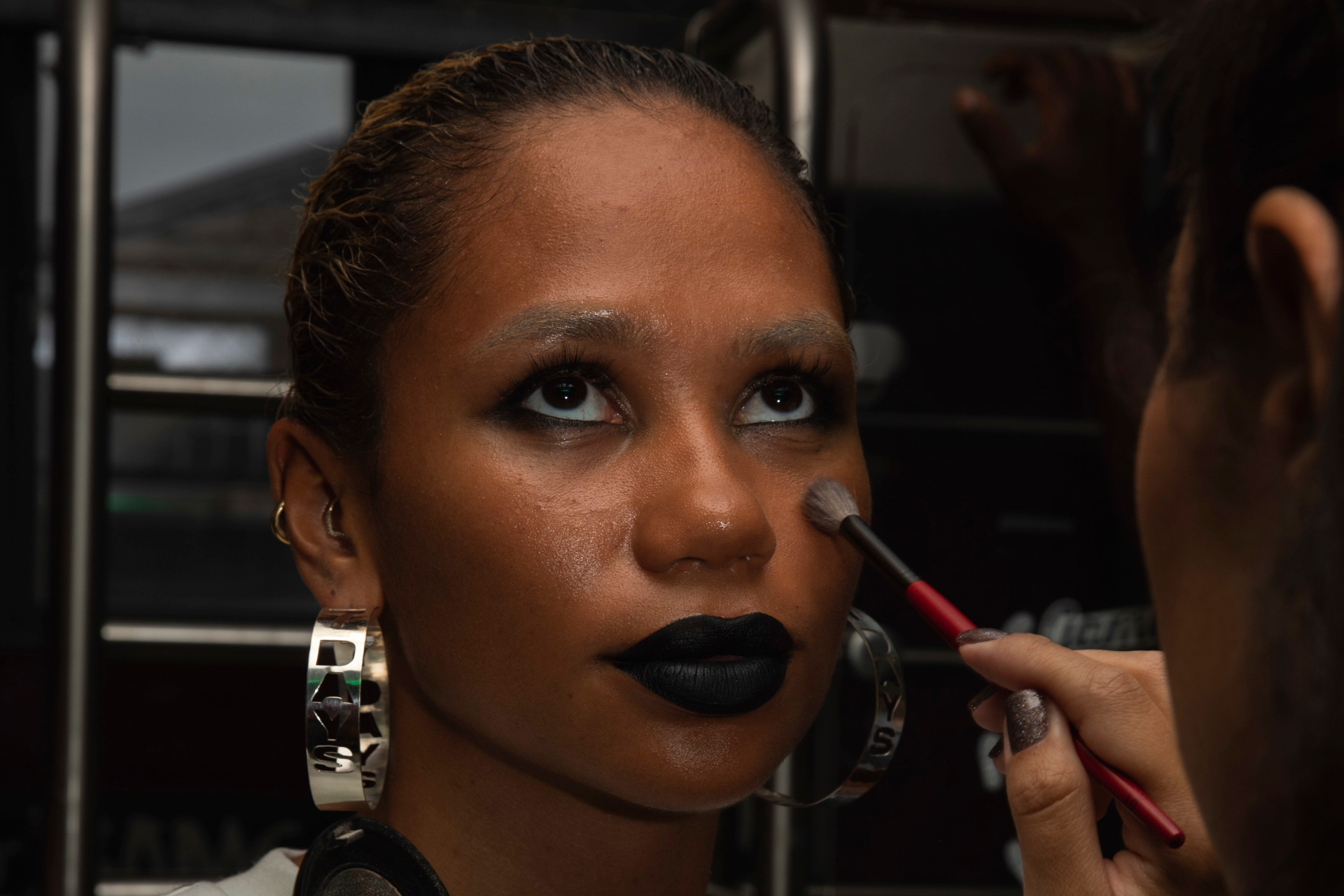 Woman getting makeup done