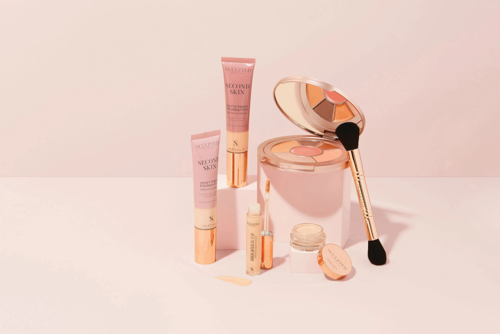Vegan makeup products on pink background