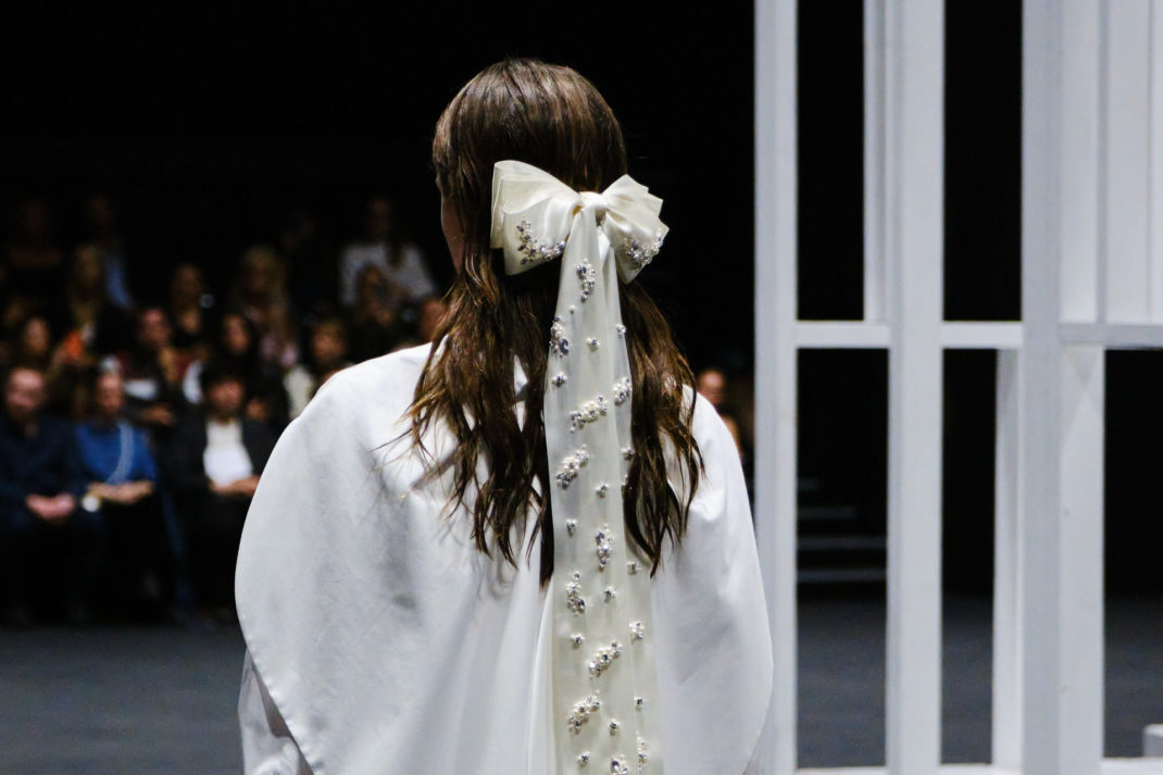 Close up of woman with bow in her hair