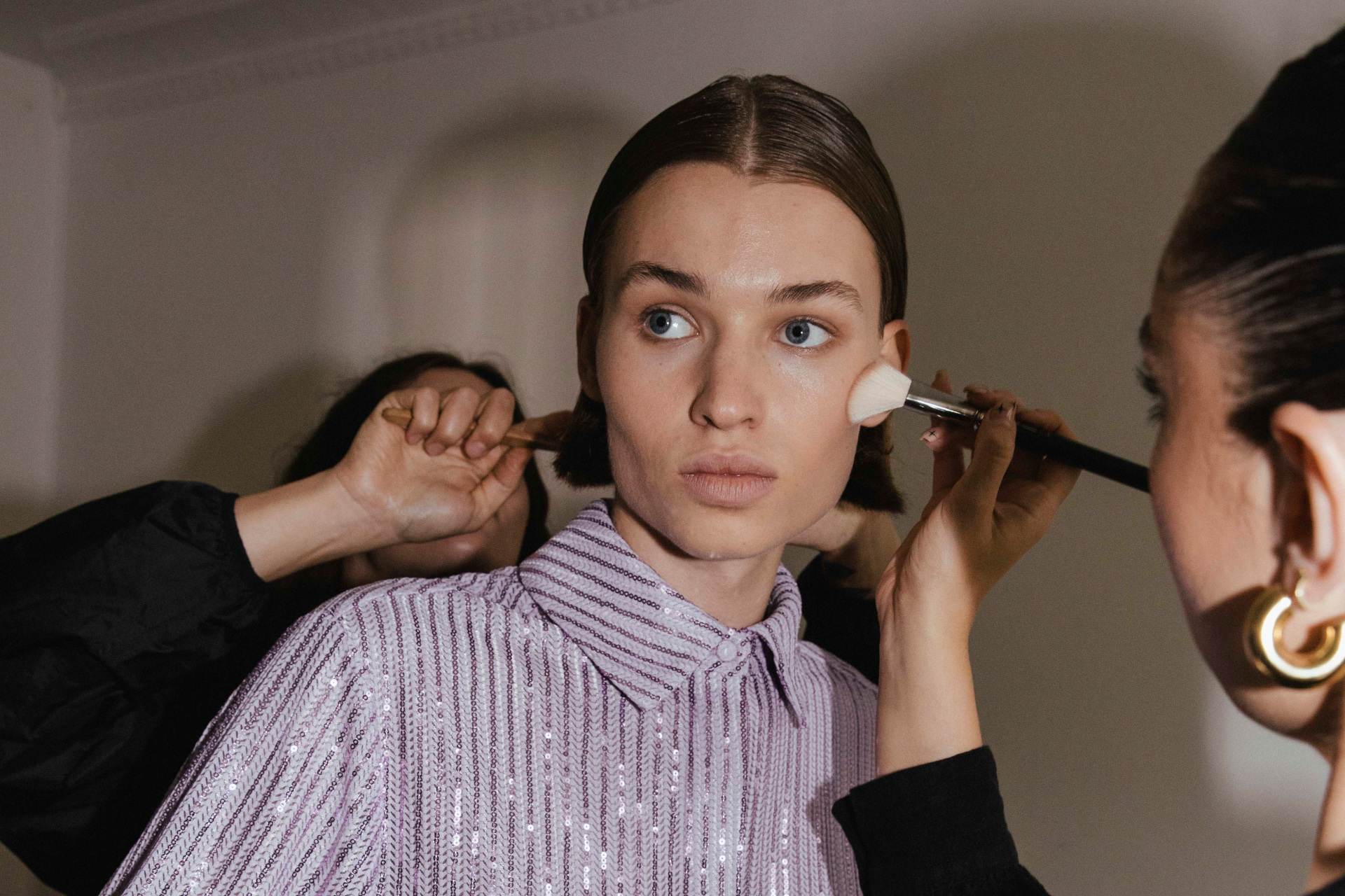 Woman getting makeup done