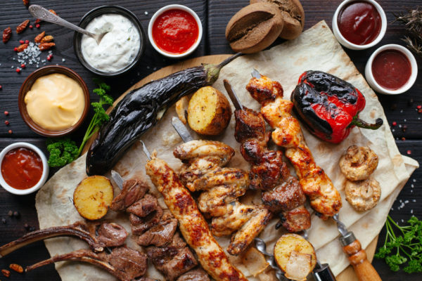 Skewered meet on wooden board