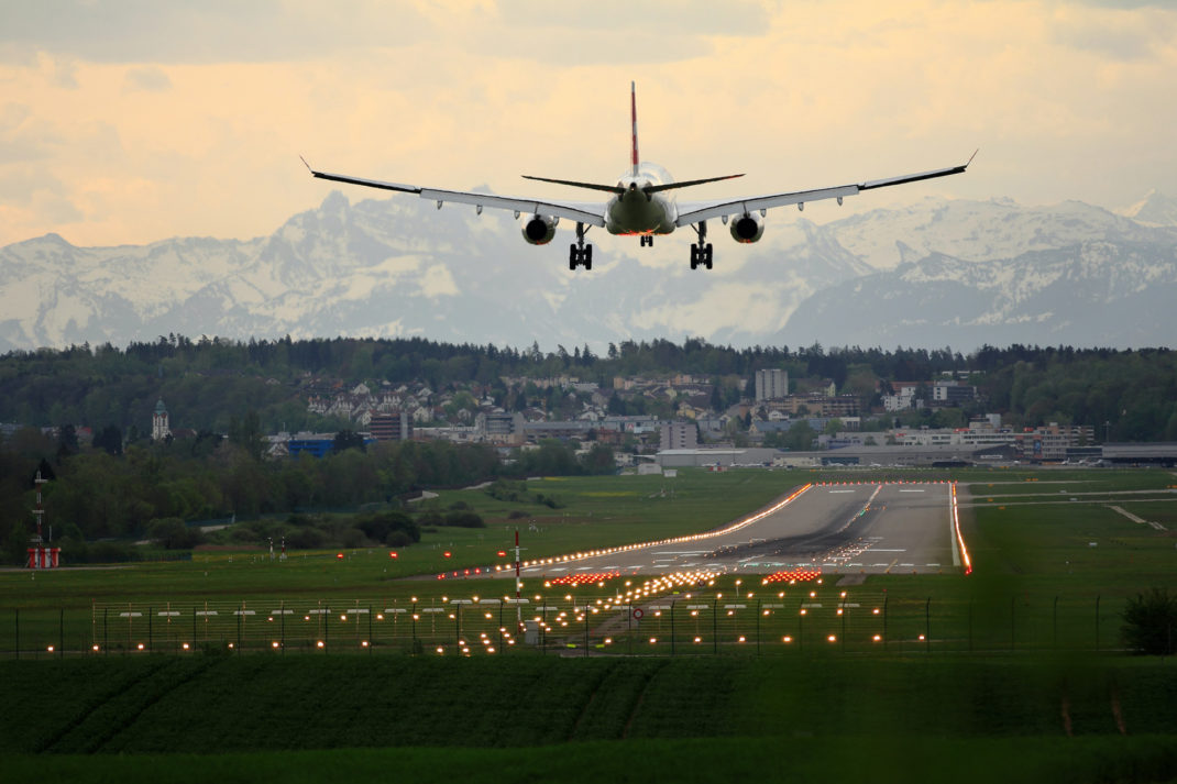 An airplane landing at an airport