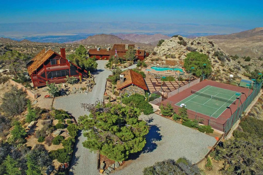 aerial view of Palm Desert home with tennis court and pool