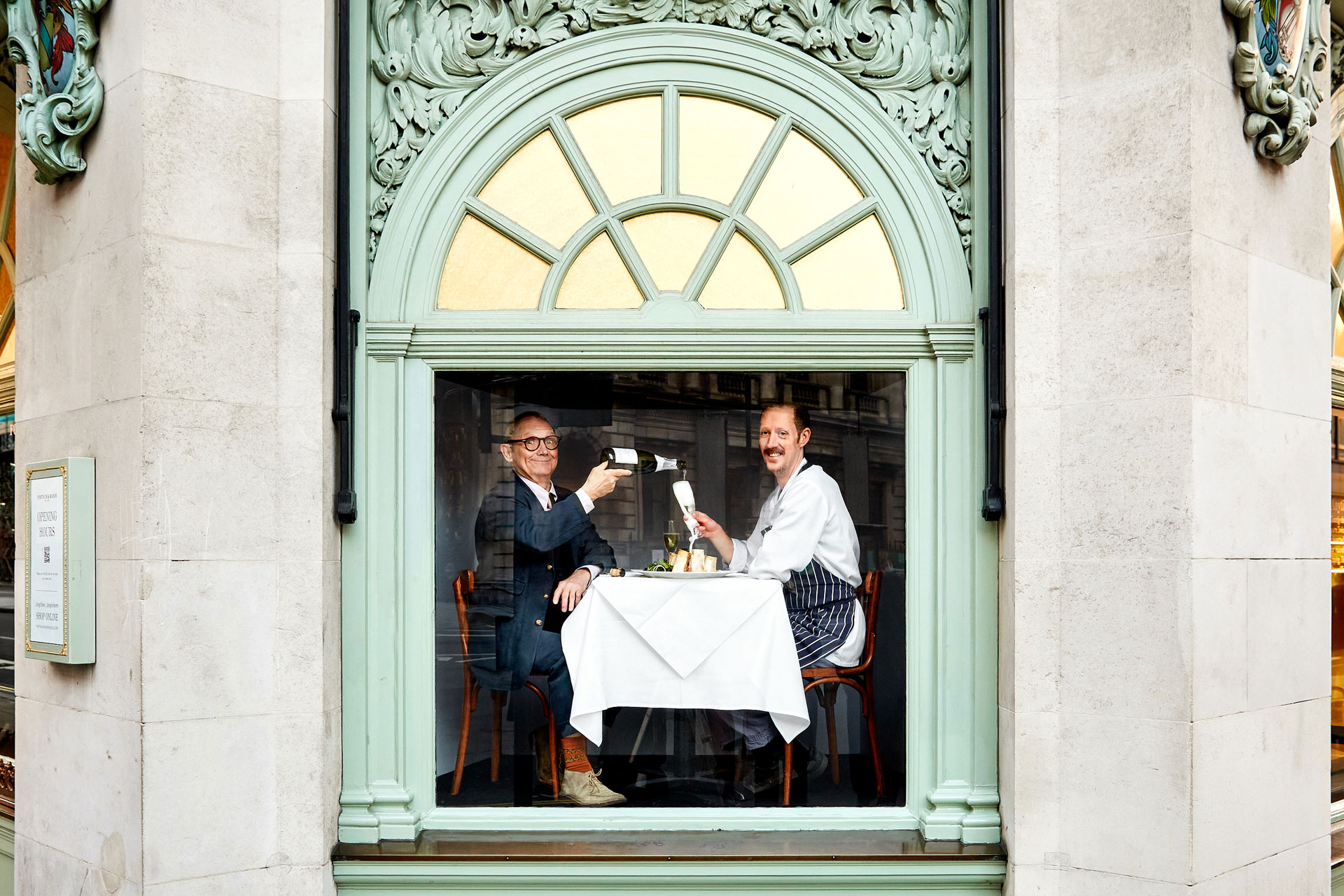 Two men sitting at a table in Fortnum & Mason