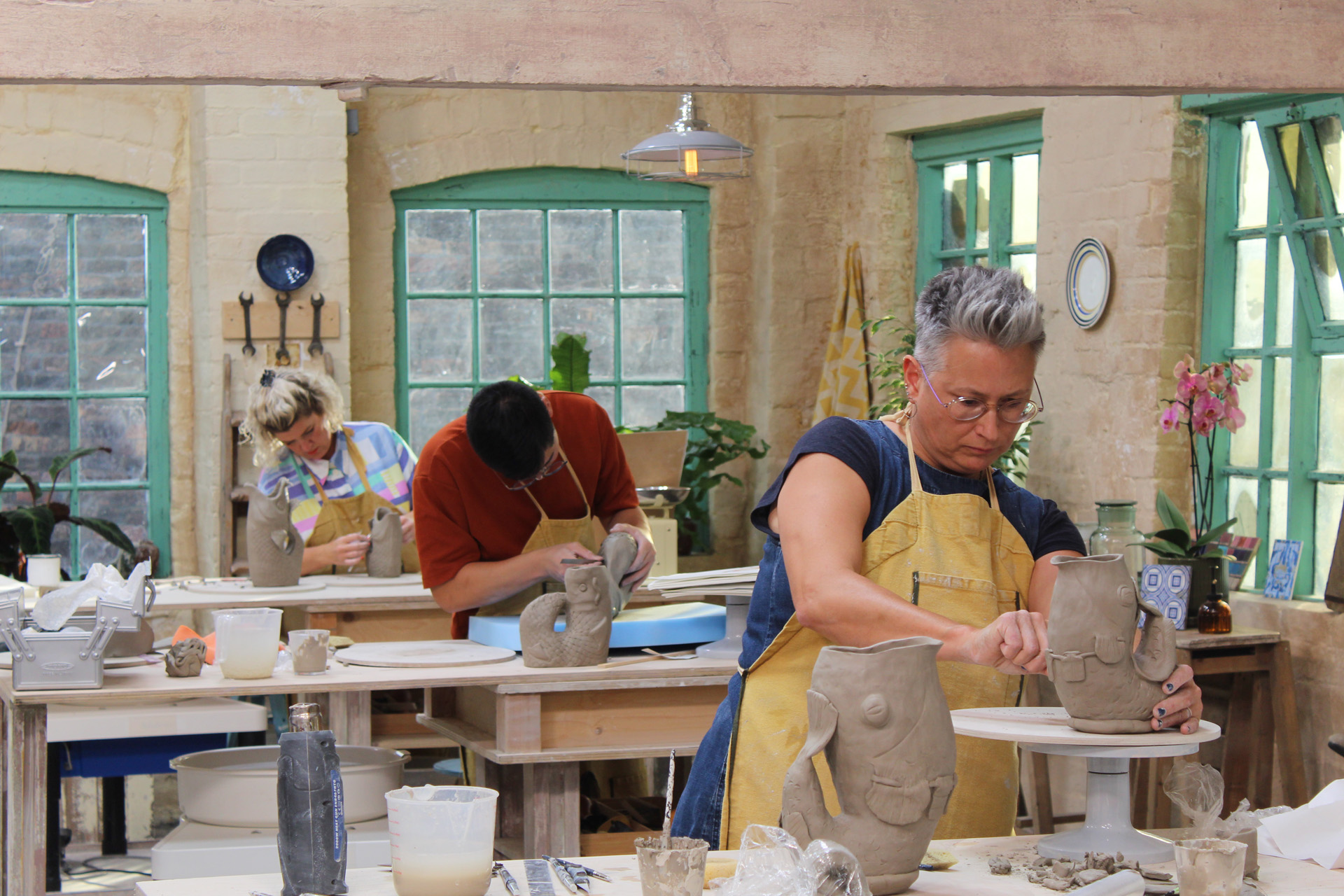 Donna, Daniel and Cadi creating their gluggle jugs in episode 2.