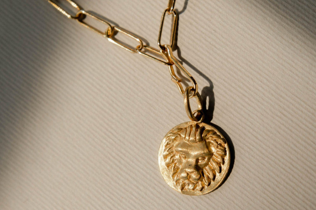 Gold chain with Leo pendant | how to dress for your venus sign