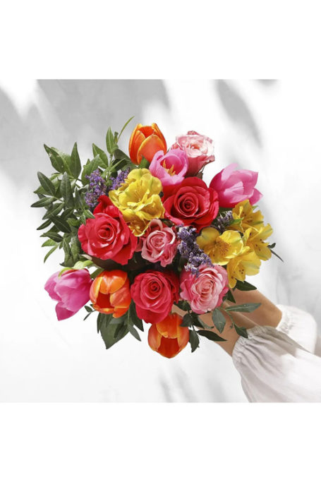 Hands holding a bouquet of flowers