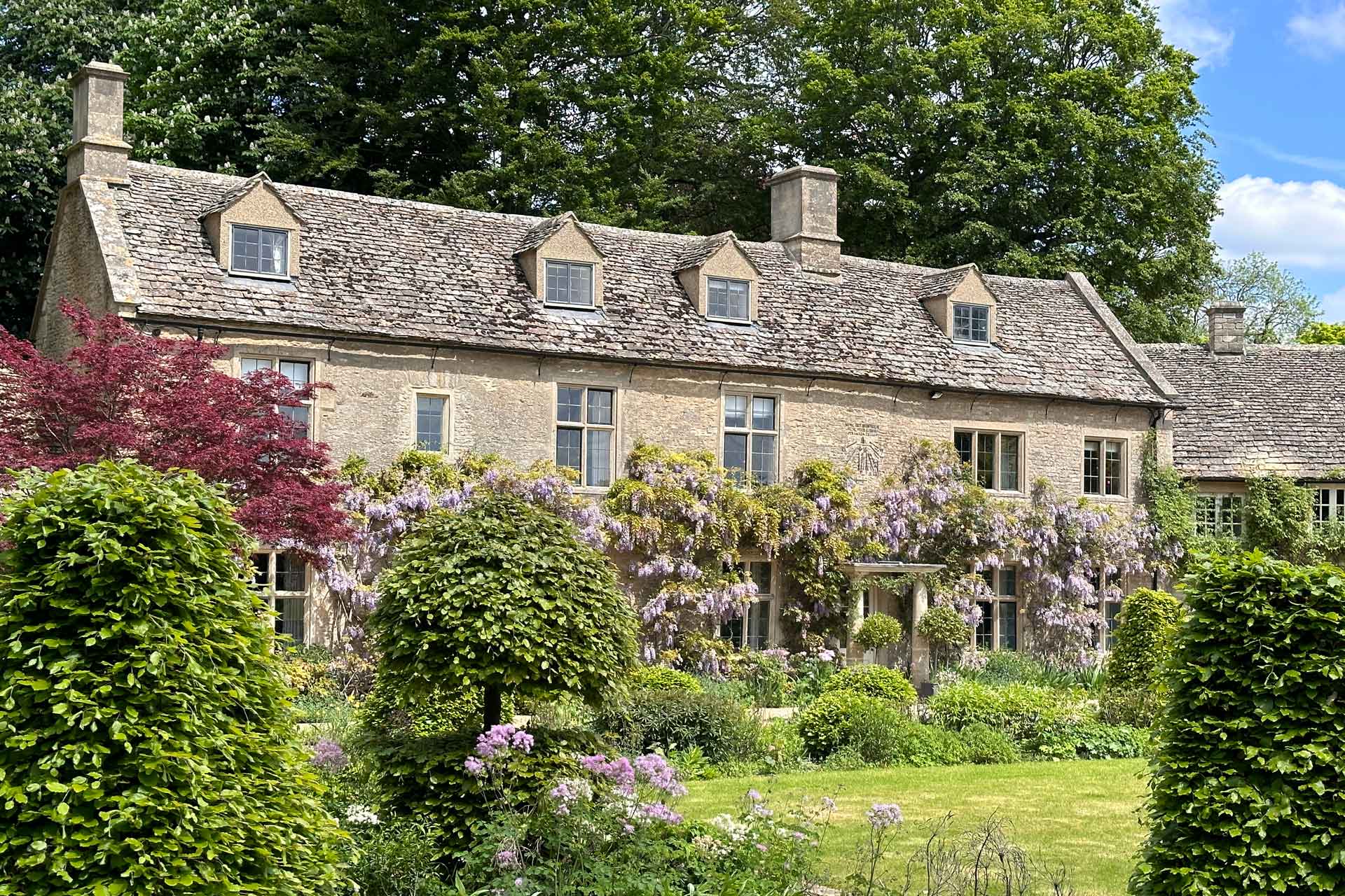 Home with wisteria-clad Cotswold stone exterior.