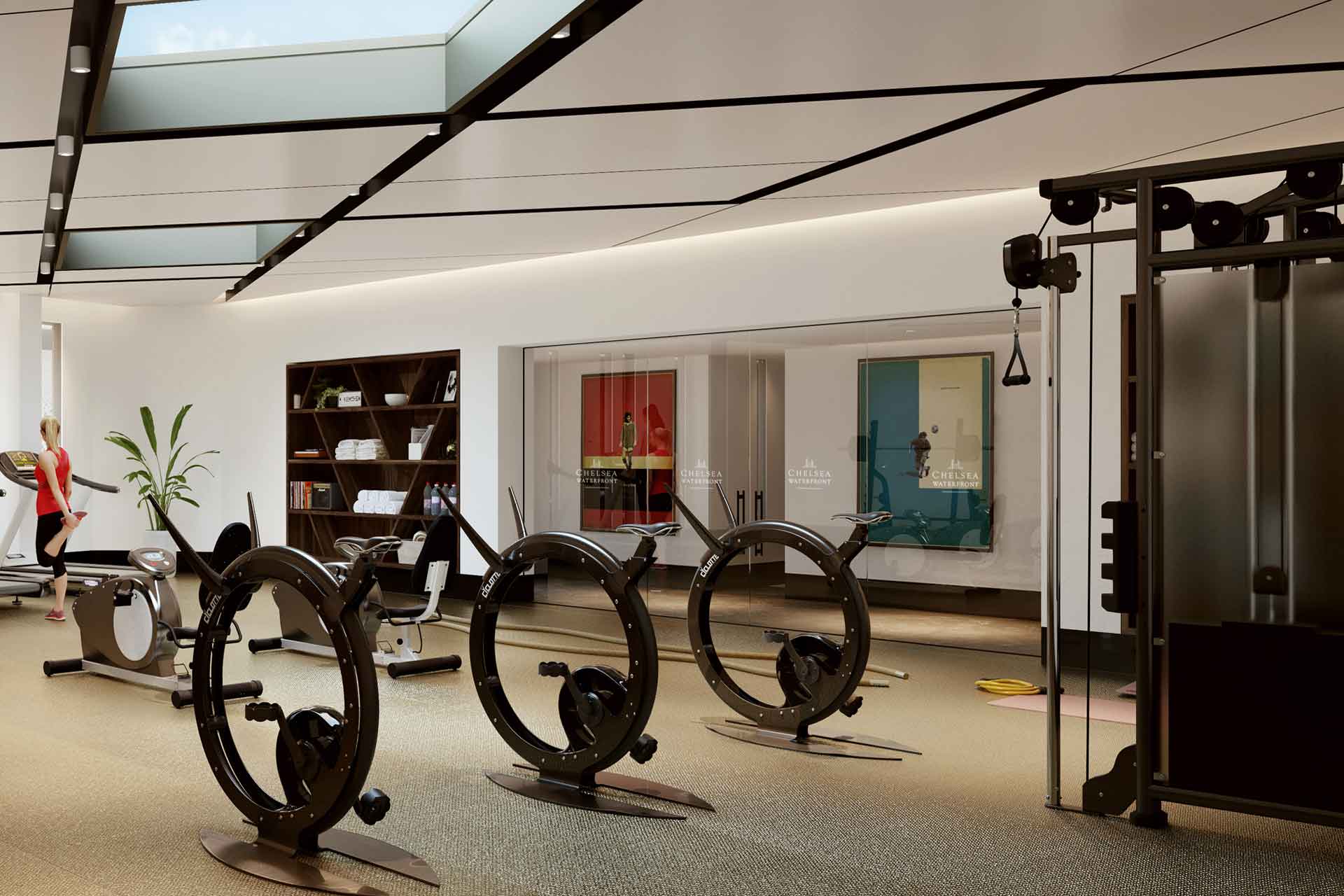 Gym with diamond-shaped skylight windows and wooden flooring.