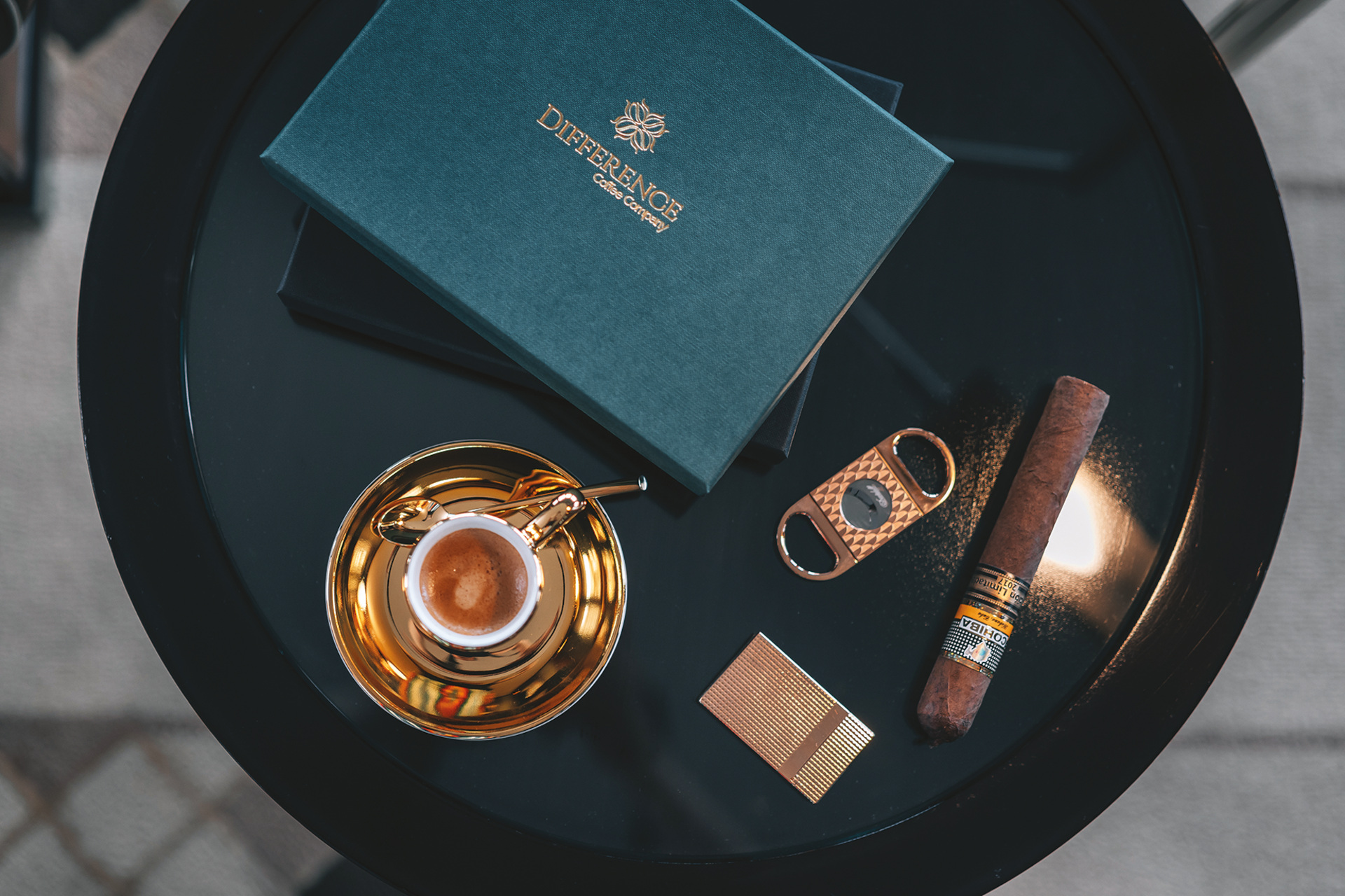 Overview of table with cup, coffee and cigar set