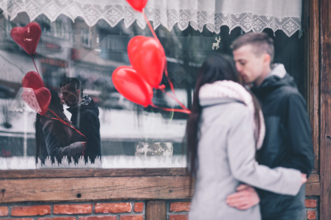 Couple with heart balloons