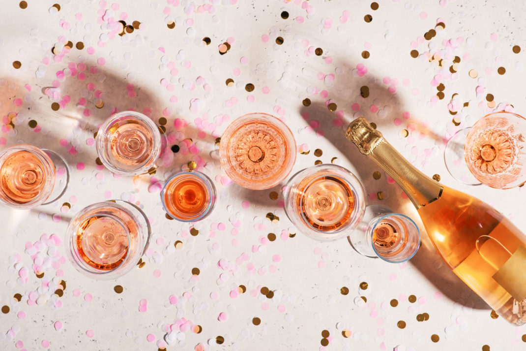 Pink champagne glasses and a bottle
