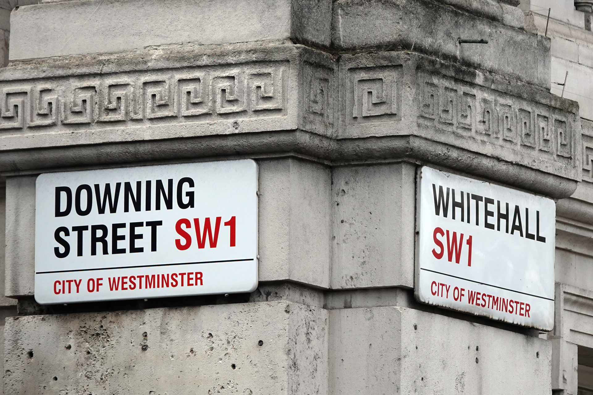 Downing Street and Whitehall signs in Westminster, London, UK.
