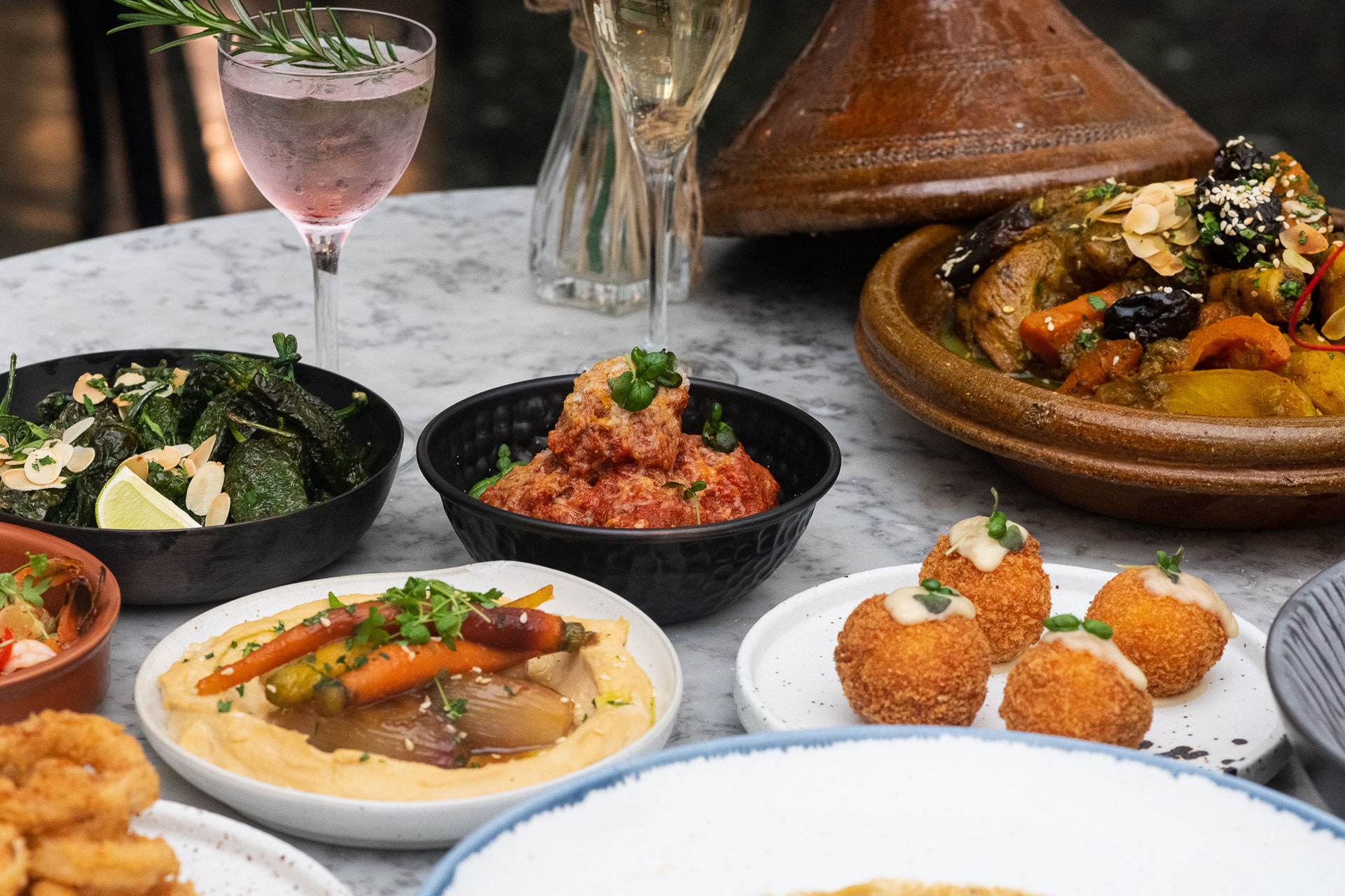 Small plates of food on a table at Bellazul restaurant in Marylebone