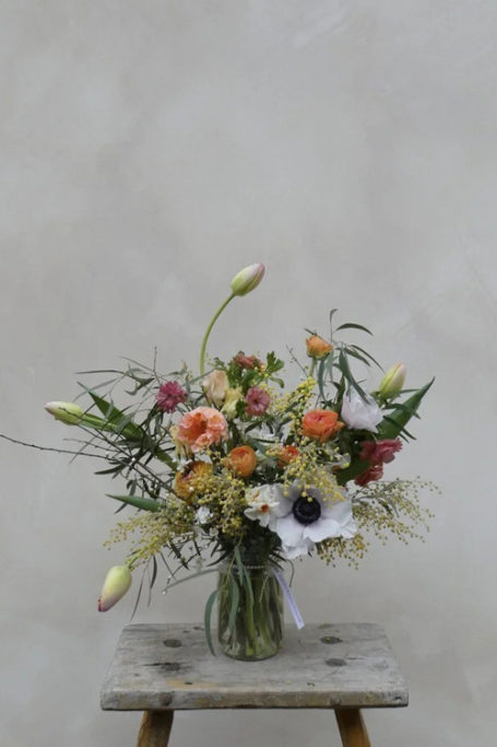 A jam jar filled with flowers